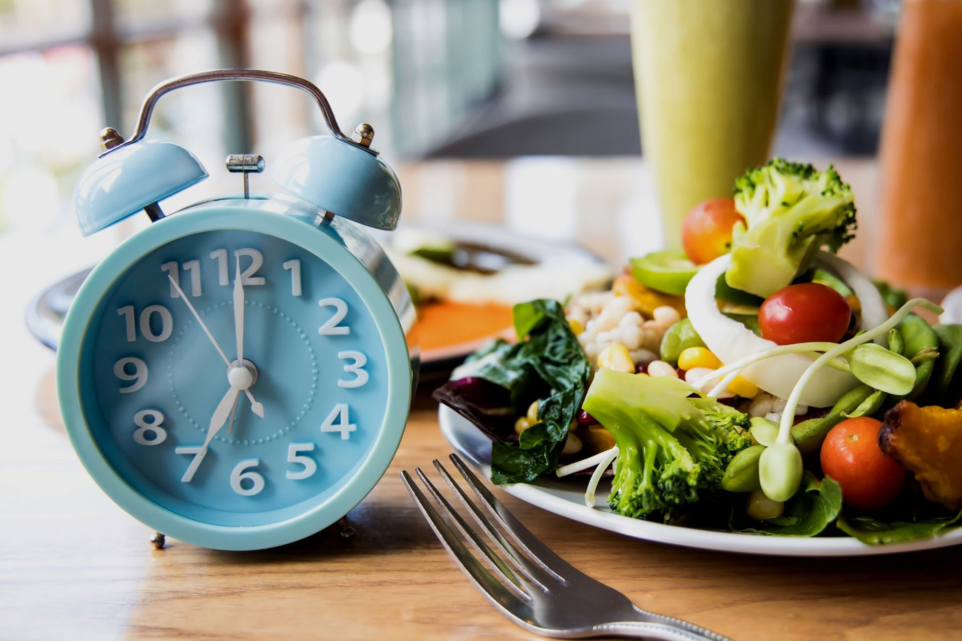 clock next to a salad