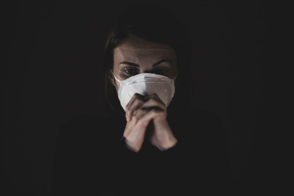 sad woman wearing mask
