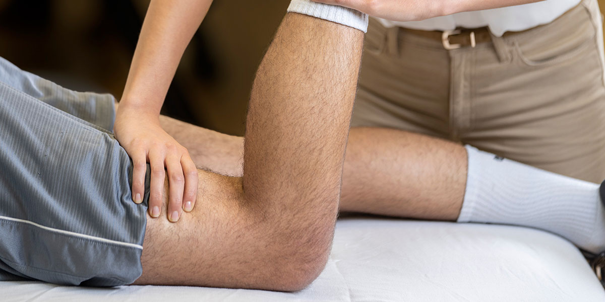 man getting a sports massage on his leg